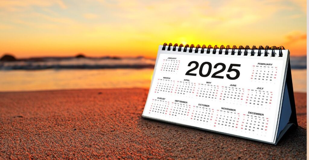 Calendário de 2025 em uma praia ao pôr do sol, simbolizando novas oportunidades e recomeços.