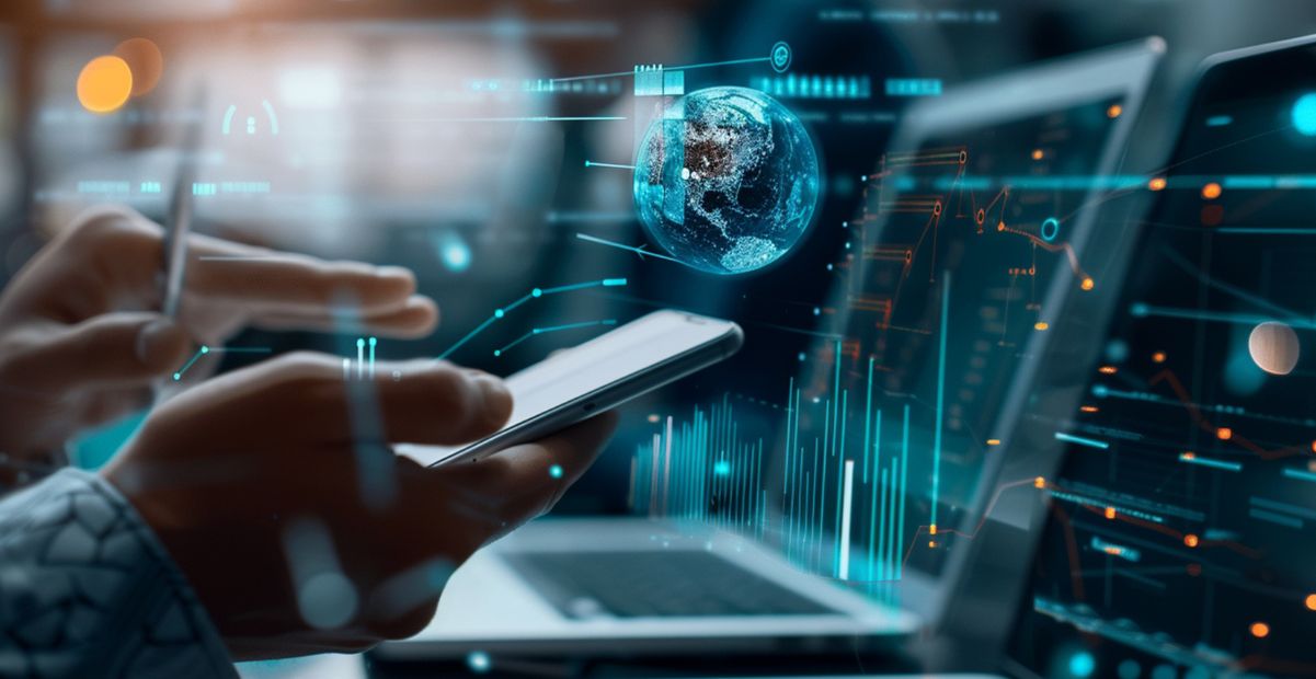 Pessoa usando smartphone e laptop com gráficos digitais e planeta flutuante, representando o conceito de polímata digital na era da informação.